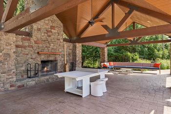 Outdoor cabana with tv, gas grills and wood burning fireplace
